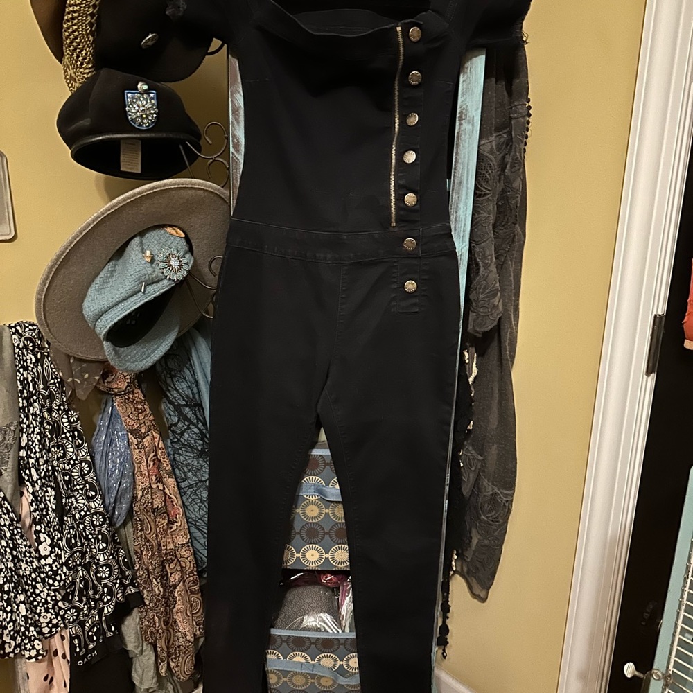 Stretch sexy black off shoulder jumpsuit.Size 9/10.Cute with heels or flats.